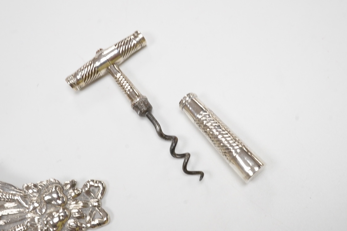 Small silver and white metal, including an Edwardian silver tea strainer, import marks for London, 1908, 15.7cm, a late Victorian silver sifter spoon, silver handled scissors with case, a white metal corkscrew and a whit